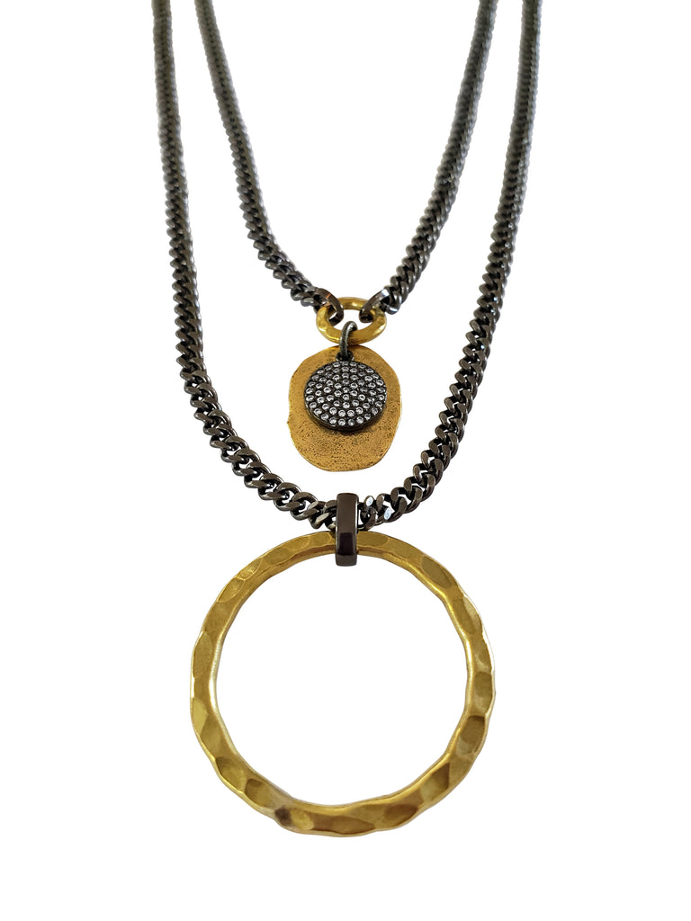 Double chain necklace.First layer has gray chain with gold color disc and black micro pave Sz disc.Second layer has large,hummered brass circle.