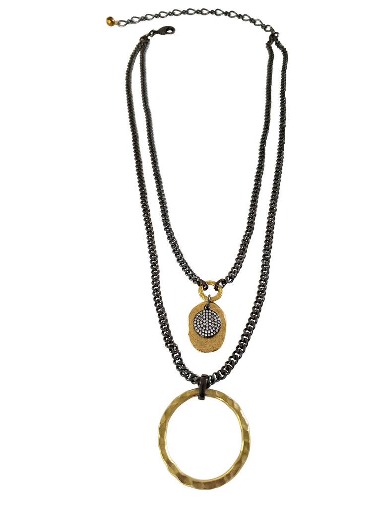 Double chain necklace.First layer has gray chain with gold color disc and black micro pave Sz disc.Second layer has large,hummered brass circle.
