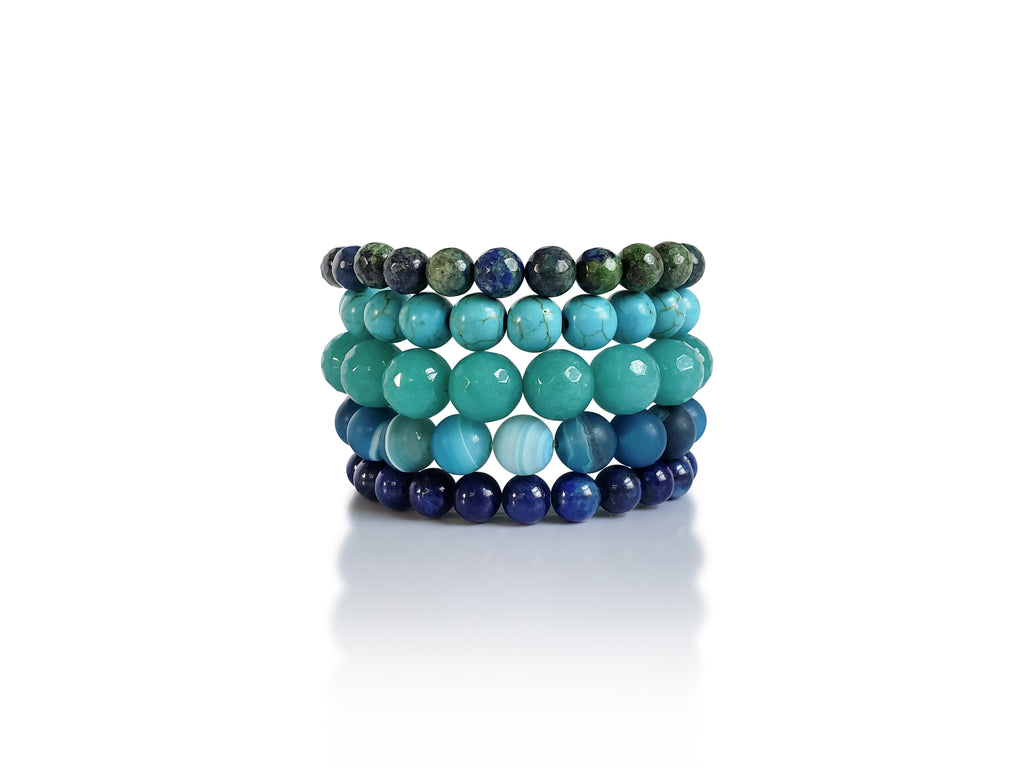 Blue green gemstone stretch bracelet set of 5 with faceted green amazonite , dark sea blue matte agate, glossy turquoise howlite and lapis lazuli beads .