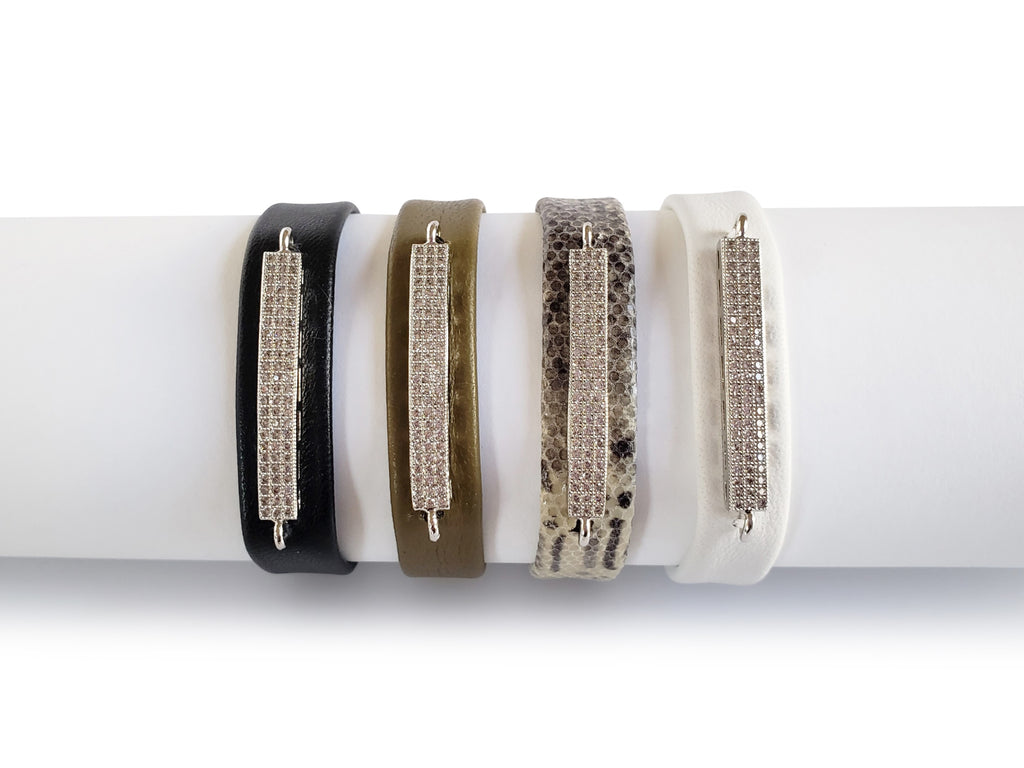 black,olive,python and white leather bracelets 0'5 inches wide with silver micro pave sz bars.