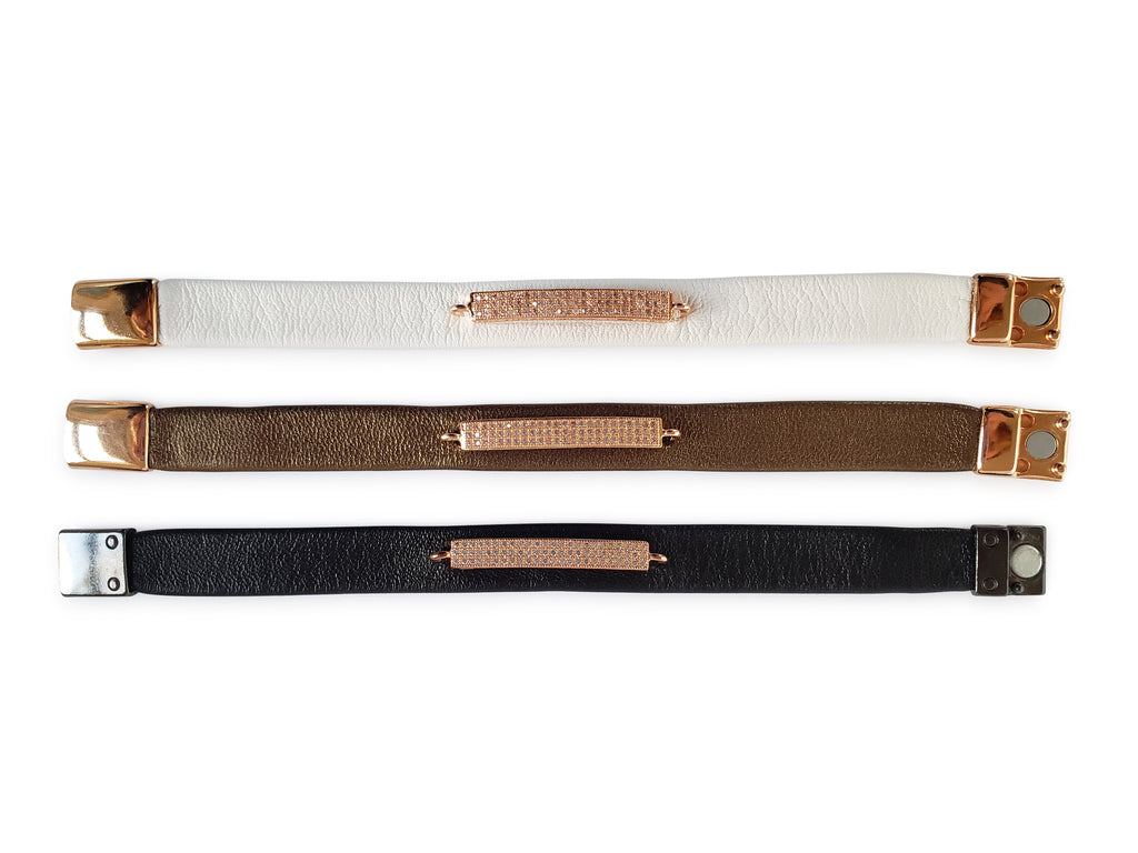 Open magnetic leather bracelets in white, bronze and black leathers with micro pave sz rose gold bar. 