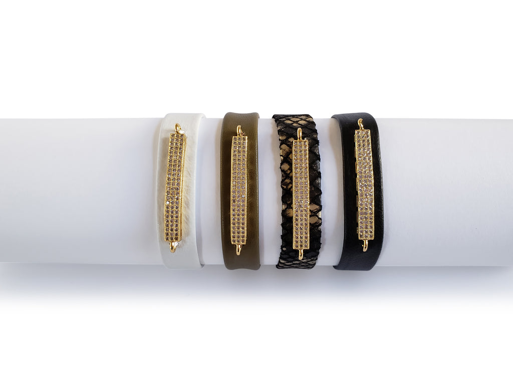 Magnetic bracelets  0,5 inches wide with gold,crystal micro pave sz bar.White leather , olive leather , black and gold python leather and black leather bracelets.