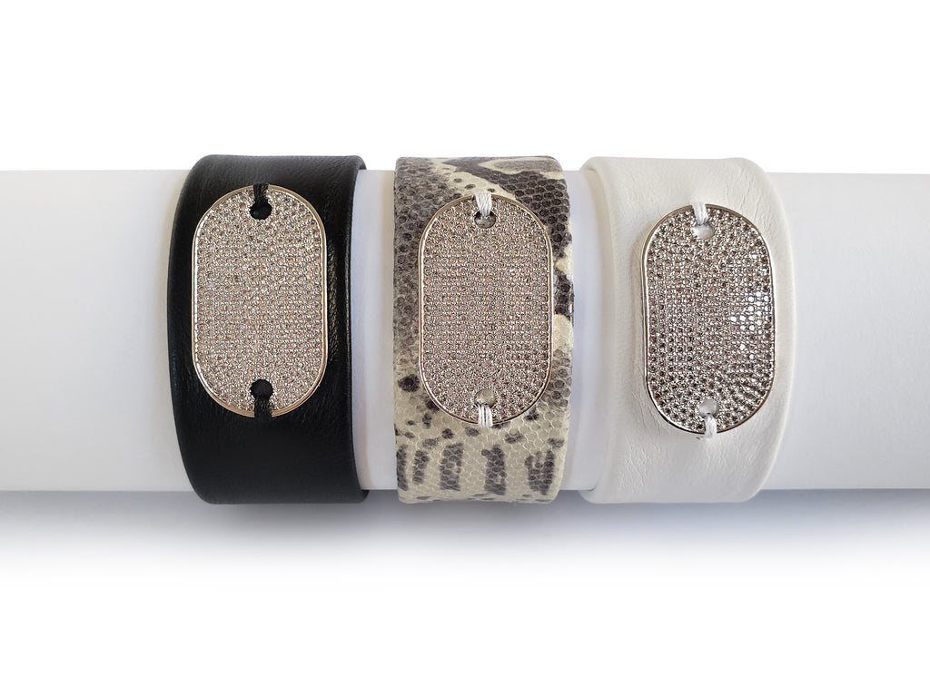 Magnetic leather bracelet with silver,crystal micro pave SZ tag.Available in black,white and python leather.