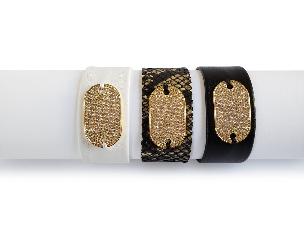 Magnetick bracelets in  black and gold python, white and black leather with gold, crystal micro pave SZ tag