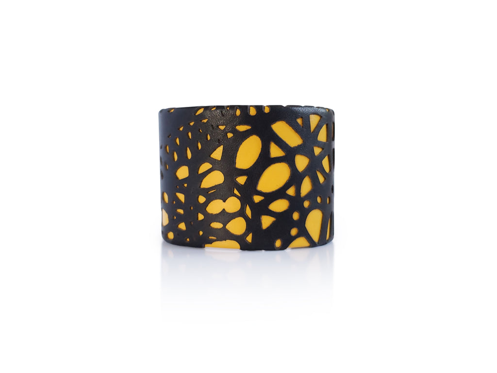 Black leather lace on yellow leather cuff. Brass base adjustable.