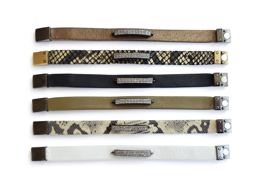 Magnetic bronze,black,olive,blackand gold , white and python  leather 0'5 wide bracelets with gunmetal micro pave sz bars.