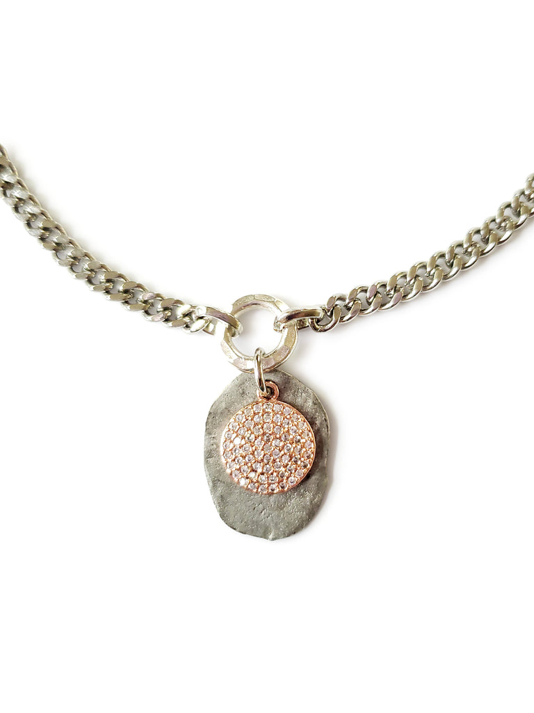 Silver color disc with rose gold micro pave SZ coin in crystal cubic zirconia.