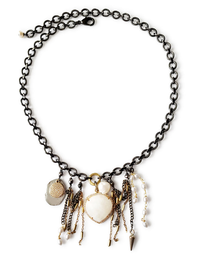 Gunmetal chain with heart shape moonstone , set in gold , crystal micro pave sz. Necklace has silver, gold discs and chain,white fresh water pearl fringe.